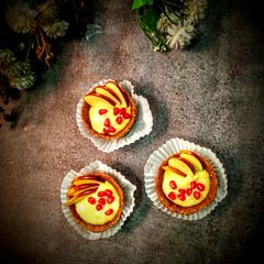 A picture of Date tart with mango cream and fruits.