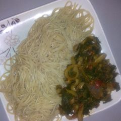 A picture of Pasta with beans and spinach sauce.