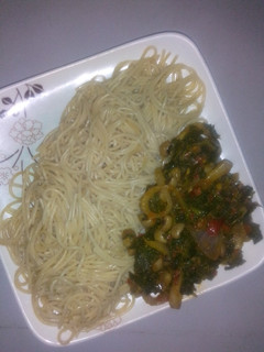A picture of Pasta with beans and spinach sauce.