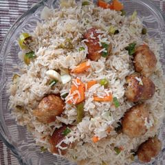 A picture of Vegetable Rice with gola kabab.