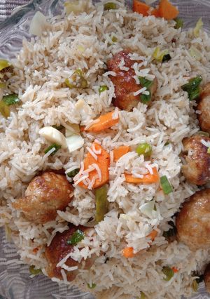A picture of Vegetable Rice with gola kabab.