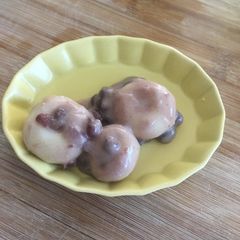 White rice dumpling with Coconut &Sweet red bean sauce A picture of White rice dumpling with Coconut &Sweet red bean sauce.