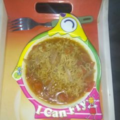 A picture of Maggi with tomato onion.