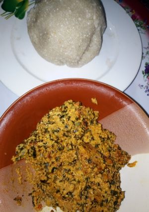 A picture of Egusi soup with White Garri (Eba).