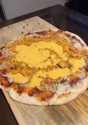 Una foto de Pizza flama Doritos