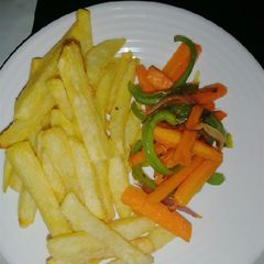 A picture of Fries and stir fry veges.