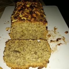 A picture of Banana bread with nuts and chocolate chips toppings..