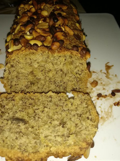 A picture of Banana bread with nuts and chocolate chips toppings..