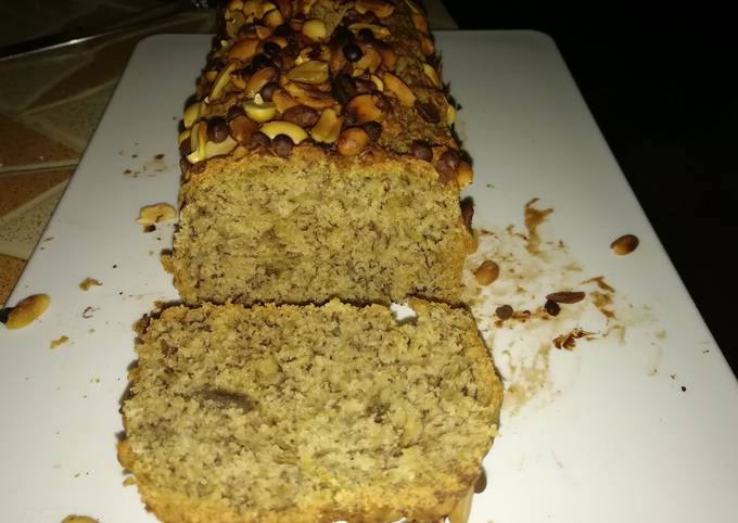 Banana bread with nuts and chocolate chips toppings.