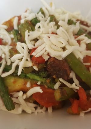A picture of Avocado, Asparagus tomato with Grated mozarella Dish.