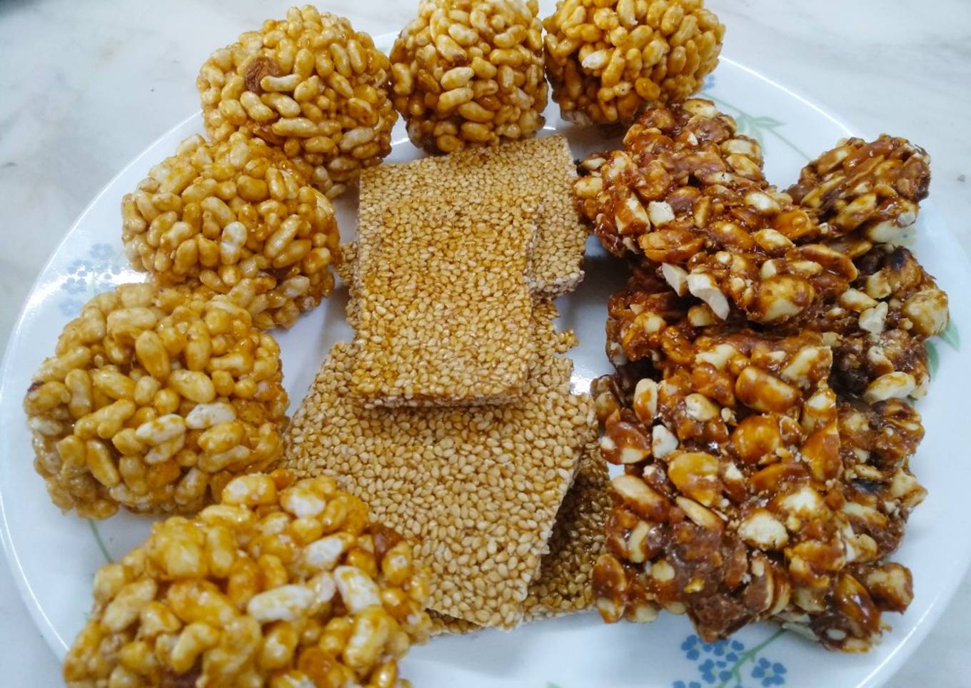 Peanut sessmme chikki and rice puff ladoo