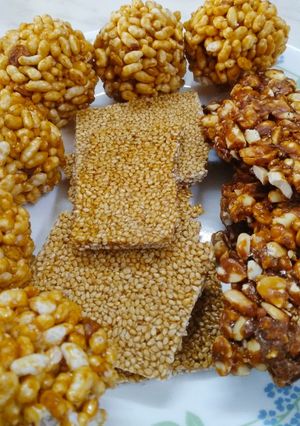 A picture of Peanut sessmme chikki and rice puff ladoo.