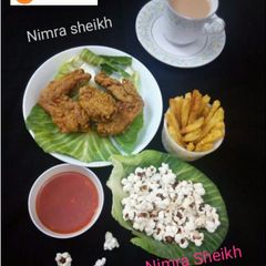 A picture of Crispy wings,  popcorns, fries.