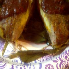 A picture of Banana Leaf  wrapped pork.