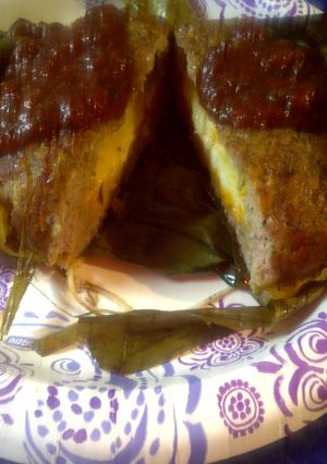 A picture of Banana Leaf wrapped pork.