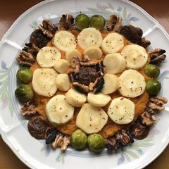 A picture of California Farm Steamed Parsnips with Roasted Walnuts.