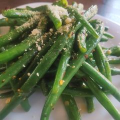 Stir Fried French Beans topped with parmesan A picture of Stir Fried French Beans topped with parmesan.