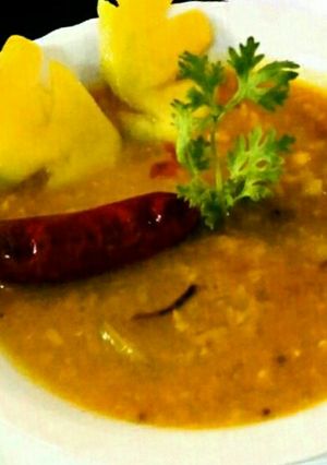 A picture of Masoor daal with raw mango.