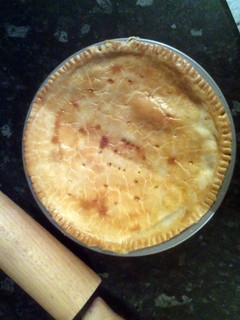 A picture of sausage and tomato pie.