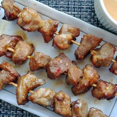 A picture of Pork satay skewers.