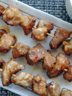 A picture of Pork satay skewers.