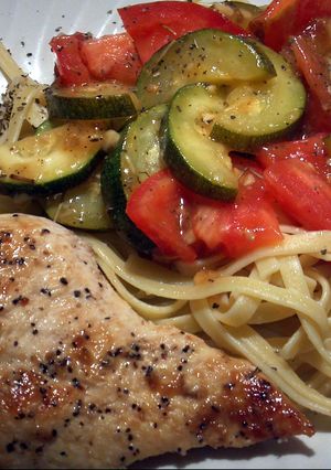 A picture of EZ Lemon Pepper Chicken with Rosemary Zucchini over Pasta.