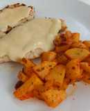 Chicken in cheese sauce and paprika potatoes