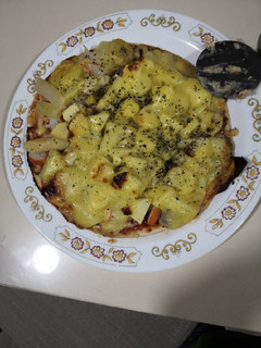 Una foto de Pizza tropical