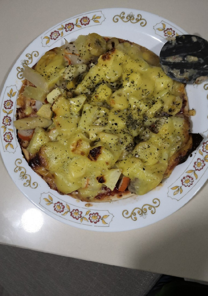 Una foto de Pizza tropical