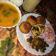 A picture of New Version Of Roti And SabziStuffed Aloo Bhindi in cooker with Mogra Dal And Masala Chaas.