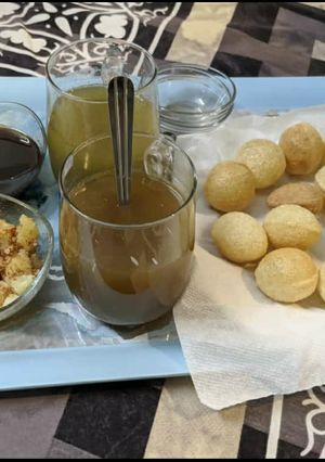 A picture of Golgappe with water.