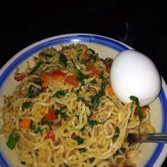 A picture of Noodles with vegies.