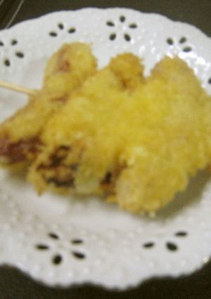 A picture of Fried Skewers with Sausage and Onion.