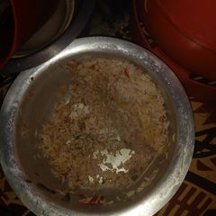 A picture of Mixture of rice and tomatoes.