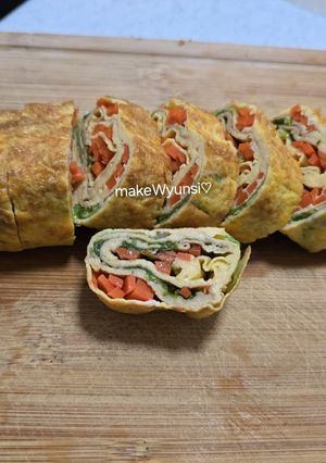 A picture of Egg rolls with veggies.