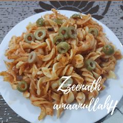 A picture of Red Sauce Pasta with Olives.