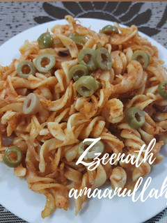 A picture of Red Sauce Pasta with Olives.