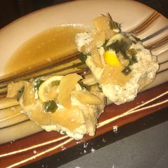 A picture of Oven baked Thai style mahi mahi with ginger, lemon,and chives.