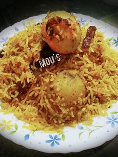 A picture of Hyderabadi egg dum biryani.