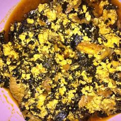 A picture of Egusi with bitterleaf soup.