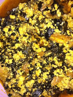 A picture of Egusi with bitterleaf soup.