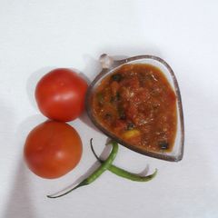 Quick tamatar kalaunji subji (tomato curry) A picture of Quick tamatar kalaunji subji (tomato curry).