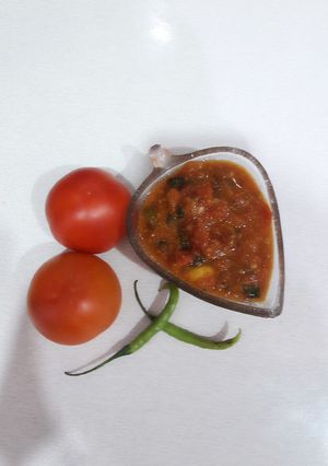 A picture of Quick tamatar kalaunji subji (tomato curry).