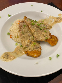 A picture of Pork Medallions in a Mushroom Cream Sauce.