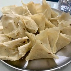 A picture of Left over roasted chicken cheesy wonton.