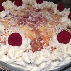 A picture of White Chocolate Raspberry Cheesecake w/ Oreo Crust.