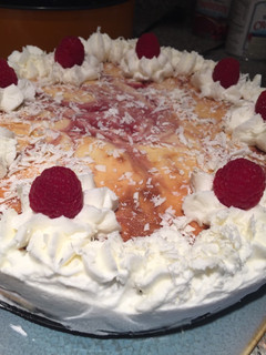 A picture of White Chocolate Raspberry Cheesecake w/ Oreo Crust.