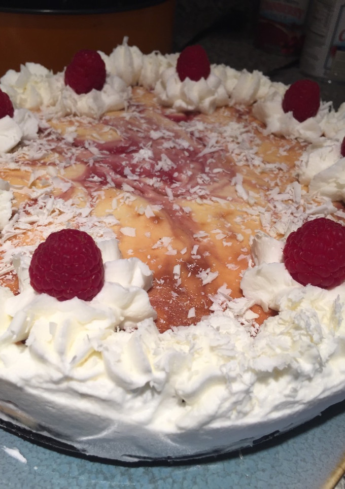 A picture of White Chocolate Raspberry Cheesecake w/ Oreo Crust.