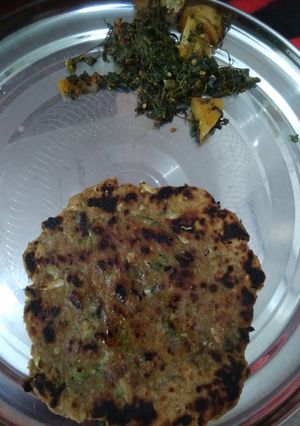 A picture of Bajra Parantha with aalo bathua Sabzi.