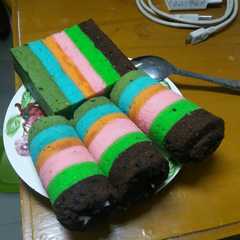 Mini cake roll rainbow isi coklat leleh dan keju parut রেসিপির প্রধান ছবি